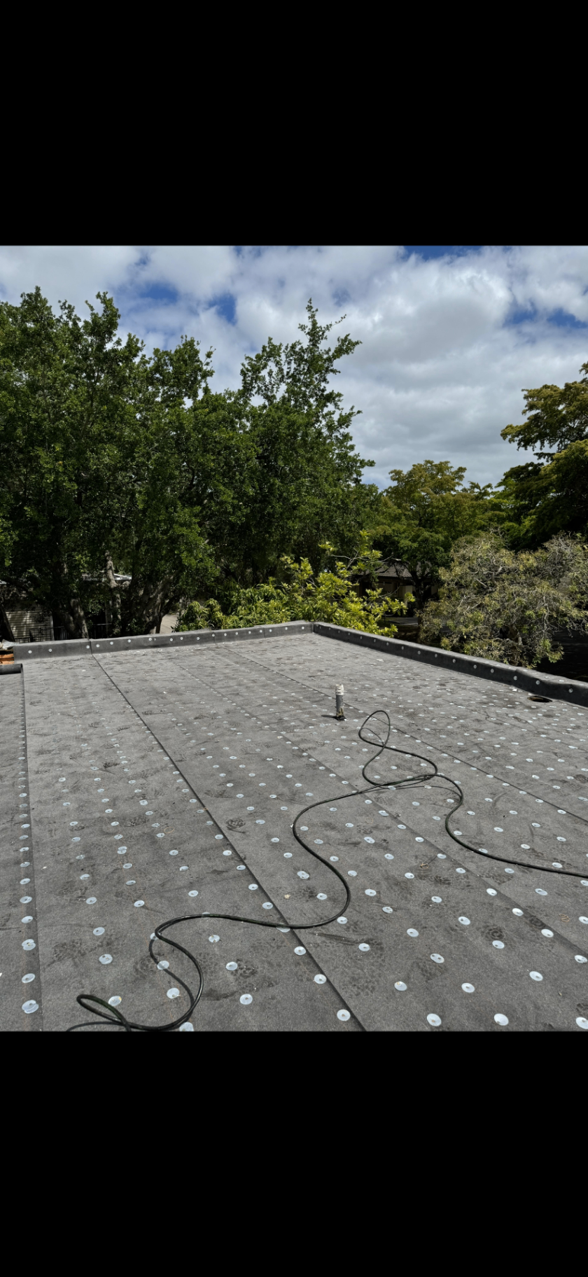 Completed flat roof base layer