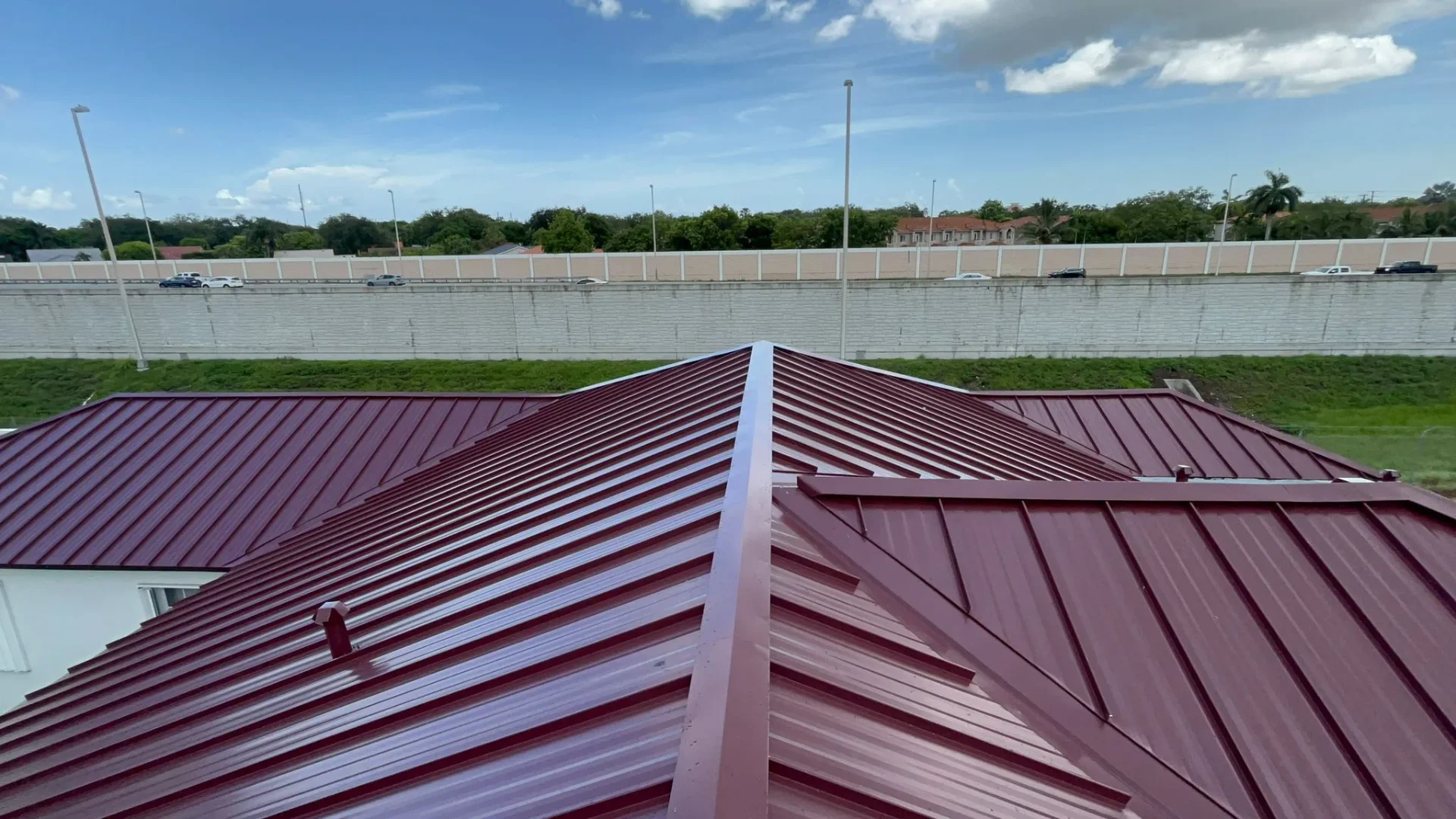 Red standing seam metal roof close-up